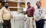 Box maker Samay Print Solutions commissions Canon imagePress C910 digital press Left to Right: Ram Dubariya (Samay Print Solutions), Saumitra Trivedi (Edifice Technologies), and Ashish Jha (Canon) with Canon imagePress C910