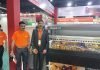 Kejie Digital shows wide format digital printers in New Delhi Rajiv Bhardwaj, CEO & project guide and Indian representative, Kejie Digital standing with a wide format digital printer at Kejie’s Stand. Photo: IPP