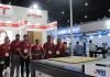 Technova shows its digital cutting table and signage media Technova team standing with Jingwei CB03II-2516 digital cutting table at their Stand in Media Expo. Photo: IPP
