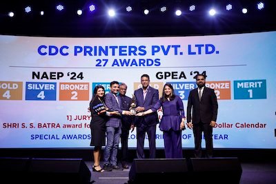 Mahesh Bhupathi and AIFMP leaders hand over some of the trophies to CDC Printers, who won 27 National and Global 2024 Awards in MumbaiPhoto AIFMP