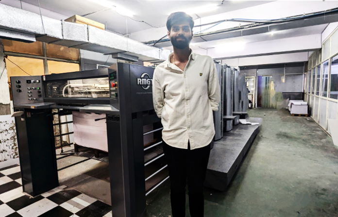 Dhruv Goel, director of First Impression, with the RMGT 920ST- 4 color sheetfed press at the plant in Noida RMGT