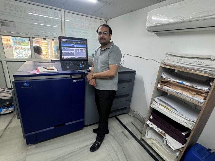 Gaurav Sharma, proprietor of Om Enterprises, with the Konica Minolta
