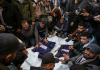 2024 was deadliest year for journalists Journalists and other mourners gather around the bodies of four Palestinian journalists and a media worker killed by an Israeli airstrike in Gaza’s Nuseirat refugee camp on December 26, 2024. (Photo: AP/Abdel Kareem Hana via CPJ)