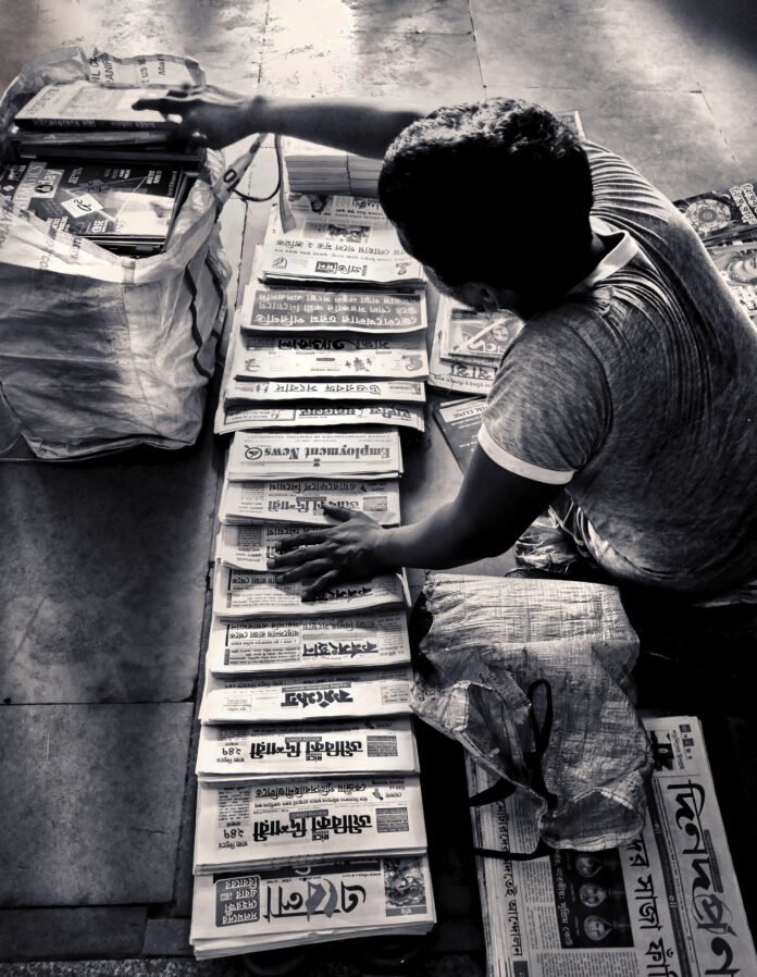 An Indian newspaper vendor newspaper