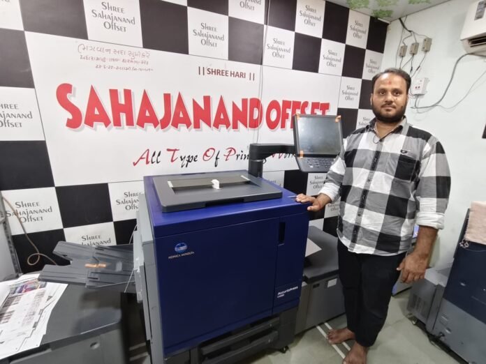 Mahesh Hadiyal, owner of the company with the Konica Minolta press