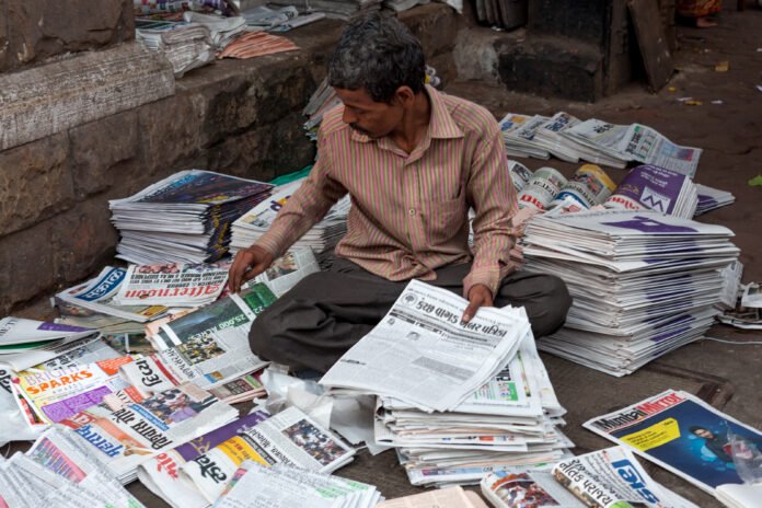 Newspaper seller on the streets on Bombay news